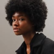 A photo of a an afro haired black woman